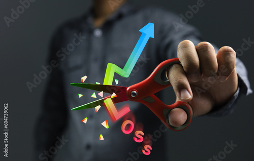 Stock market investor choose to use the stop loss method to saving costs or willing to sell losses before the price goes down much further. Scissors cutting graph 3D to broken for cut loss concept.