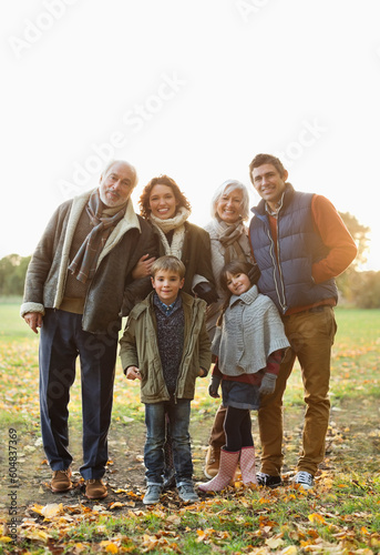 Family smiling together in park