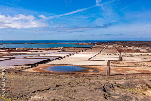 Construction of small stone on sand. Stone barriers on the seashore. Canary Islands.
