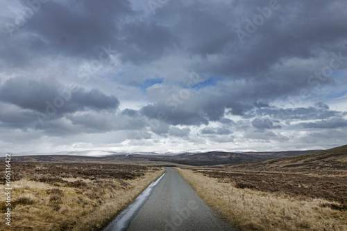Scottish Highlands. Dalnaspidal. Scotland. Peatfields. Road and clouds. 