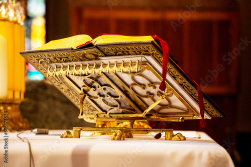 book of the catholic priest on the holy mass near the altar.