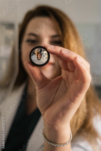 Vertical portrait of an ophthalmologist in her consultation room