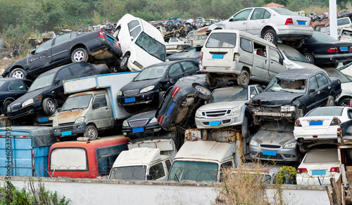 A pile of abandoned cars on junkyard