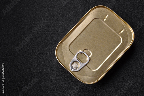 Tin or aluminum rectangular can of canned food with a key