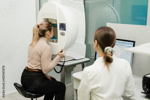 Perimetry eyes test for early sign of glaucoma of woman patient of ophthalmology clinic. Perimetry visual field test for measure all areas of eyesight, including side, or peripheral vision.