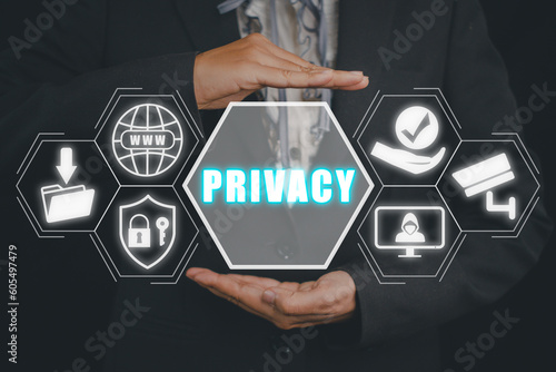 Privacy concept, Business person hand holding privacy icon on virtual screen.