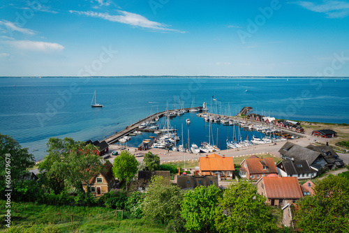View over Kyrkbacken harbor on the Swedish island Ven in the Oresund strait. Denmark can be seen in the background.