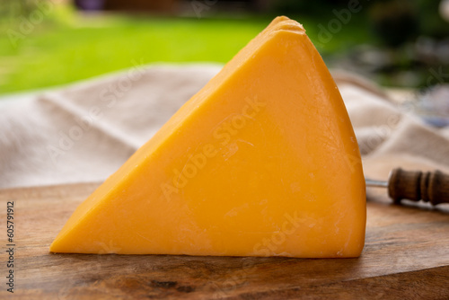 Cheese collection, piece of matured British yellow cheddar cheese made in Somerset from cow milk