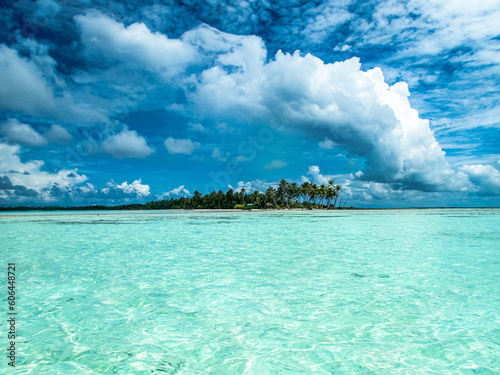 Polynesian Island in the Blue Lagoon at Rangiroa Atoll, French Polynesia, in the South Pacific