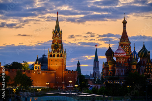 Spasskaya Tower and St Basil Cathedral are illuminated in evening.