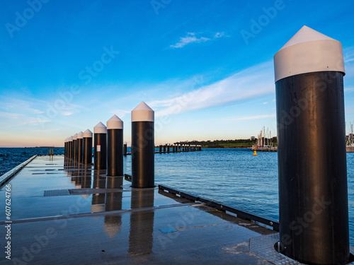 Wave attenuators to reduce or eliminate powerful, natural and incidental waves at Geelong waterfront harbour precinct in Corio Bay in Australia.