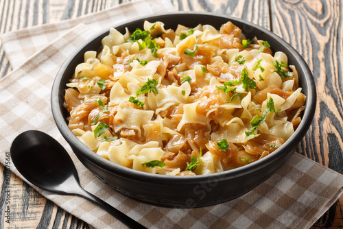 Noodles with stewed cabbage Austrian cuisine closeup on the bowl on the table. Horizontal