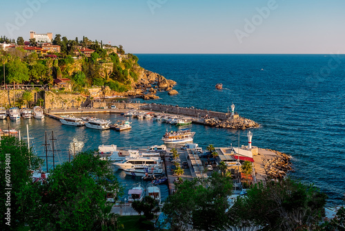 View from a height of the harbor near the old town of Kaleichi in the Turkish city of Antalya. Old port in Antalya with many ships and boats. Popular tourist place in Anatalya.