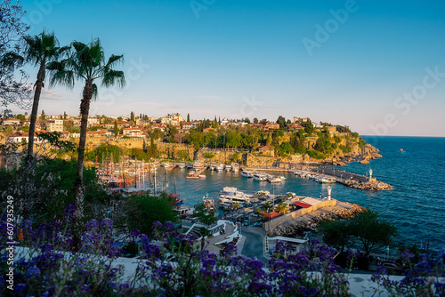 View from a height of the harbor near the old town of Kaleichi in the Turkish city of Antalya. Old port in Antalya with many ships and boats. Popular tourist place in Anatalya.