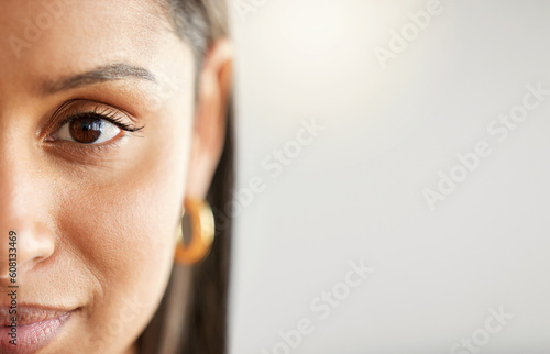 Woman, eye and face portrait with space for mockup, advertising or vision on a studio background. Zoom and half headshot of a female person or student with natural beauty, focus and concentration