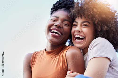 Couple of friends, black women and hug outdoor while laughing with freedom, happiness and lgbtq love. Face of happy, lesbian and african people together for space in sky or funny adventure in London