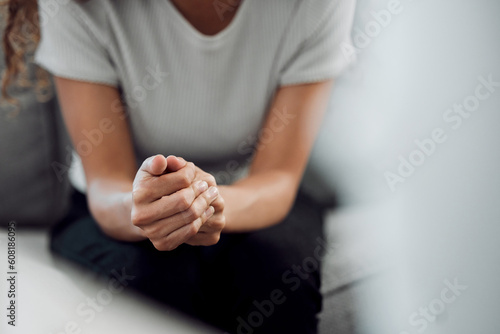 Hands, psychology and mental health with a woman in a therapy session for grief counseling after loss. Anxiety, stress or depression with a female patient feeling nervous in a clinic for support