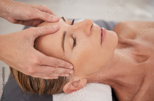 Spa, treatment and hands with a head massage for facial wellness, luxury therapy and sleep. Skincare, health and a masseuse massaging temple of a woman at a salon for reflexology and acupressure