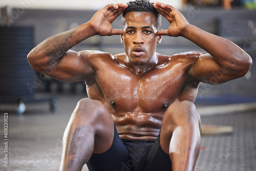 Black man in gym, sweating from sit ups for fitness and abs, exercise routine with muscle and focus. Health, active and determined with core workout, strong male person with sports and training