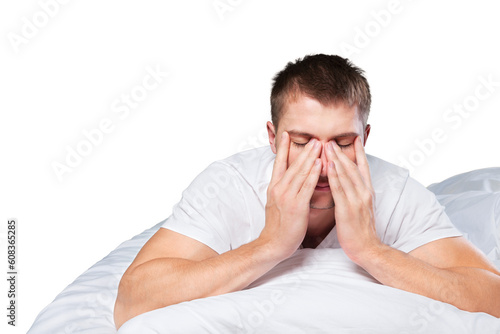 Upset male because of lack of sleep lying in the bed