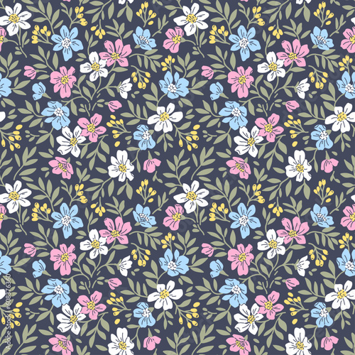 Beautiful floral pattern in small retro flowers. Small pink and blue flowers. Dark violet background. Ditsy print. Floral seamless background. Stock vector for printing on surfaces. Vintage flowers.