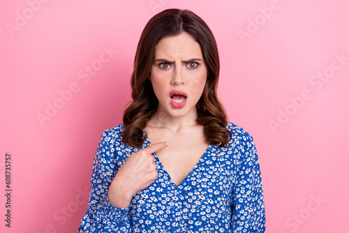 Photo of angry annoyed mad woman with wavy hairdo wear blue dress directing at herself false accusation isolated on pink color background