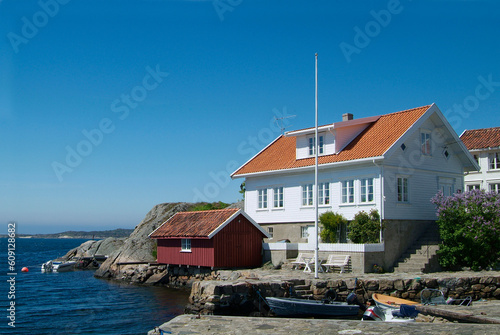 House and boathouse by the sea in Loshavn near Farsund in Vest-Agder on the south coast of Norway