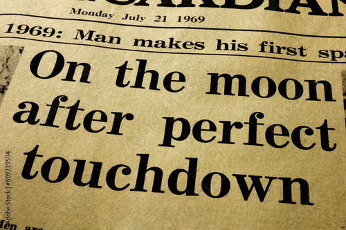 History. Close-up of the headline from a paper, the day after the first man landed on the Moon.