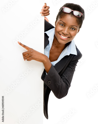 Pointing, mockup poster and portrait of a black woman isolated on a white background in a studio. Happy, presentation and an African business ambassador with a blank sign for information space