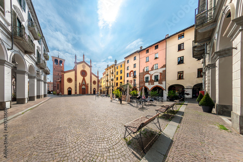 Pinerolo, Turin, Piedmont, Italy - landscape of San Donato square with San Donato Cathedral (10th - 15th cent.) and and ancient mediaeval palaces with arcades