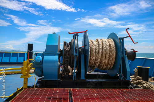 Mooring winch on a forward of a ferry with rope and chain in drum. Mechanical device equipment for ship mooring in port. Anchor winch mechanism in ship. windlass poop deck mooring rope