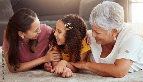 Smile, generations and relax with family on floor of living room for bonding, care and love. Happiness, trust and grandmother with young child and excited mom at home for play, support and together