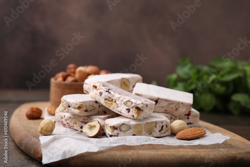 Pieces of delicious nutty nougat on board