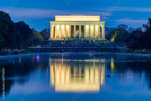 Illuminated Lincoln Memorial viewed across the pond at twilight