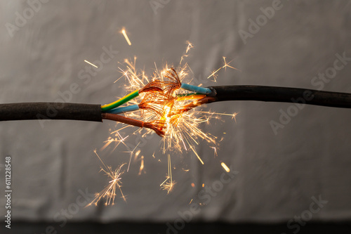 sparks explosion between electrical cables, fire hazard concept