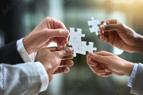 Puzzle, business hands and group of people for solution, teamwork and goals, integration or workflow success. Team building, games and development of person problem solving, synergy or collaboration