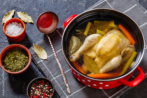 cooked chicken bouillon of whole chicken in pot