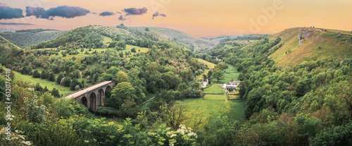 Panoramic landscape from Monsal Head looking down to the Monsal trail viaduct in Derbyshire Peak District. 