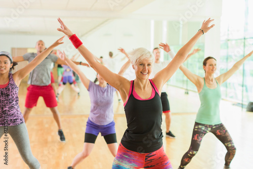 Fitness instructor leading aerobics class