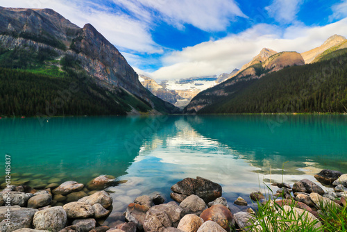 The Iconic, world famous, picture perfect Lake Louise is framed in the early morning sun near Banff in the Canada rockies