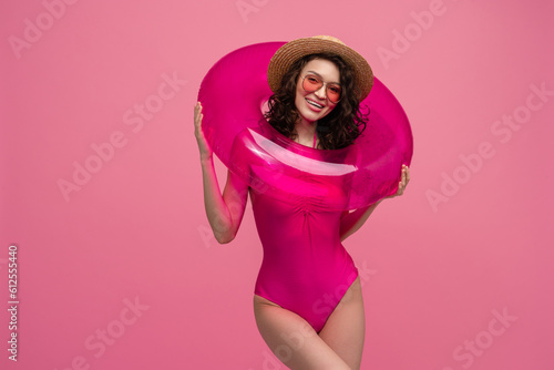 smiling slim happy beautiful woman in stylish swimwear wearing sunglasses
