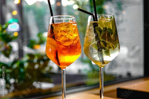 Closeup shot of an Aperol Spritz and a Hugo Cocktail