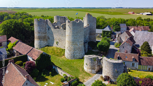 Aerial view of the medieval castle of Yèvre le Châtel in the French department of Loiret - Enclosure with 4 round towers at the top of a hill in a rural village