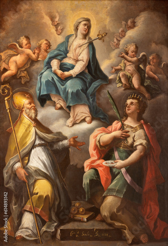 NAPLES, ITALY - APRIL 22, 2023: The painting of Virgin Mary with the St. Nicholas and Lucia in the church Chiesa della Pieta dei Turchini by Giuseppe Scala (1722).