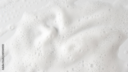 Abstract background white soapy foam texture. Shampoo foam with bubbles