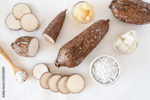 Cassava root on white background with tapioca pearls