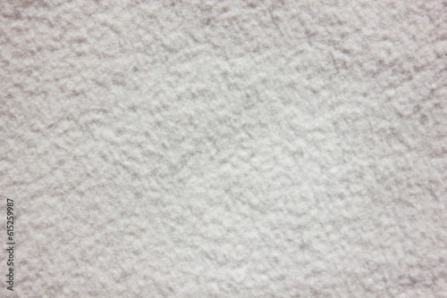 White delicate soft plush fleece fabric texture background. Background pattern of soft warm material