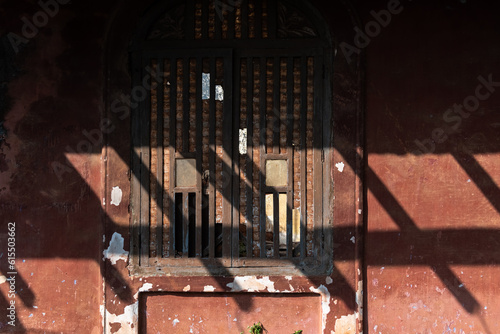 Detail of a ruined wooden window of an old Portuguese era house in Goa.