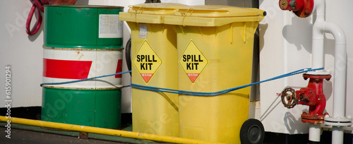 Spill kit yellow wheelie bin for health and safety of chemical, oil, diesel or petrol pollution leak