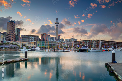 Cityscape image of Auckland skyline, New Zealand during sunrise.